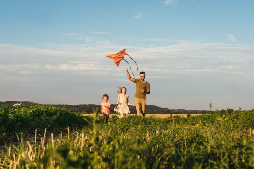 happy-family-flying-a-kite-2021-09-02-08-42-32-utc-min